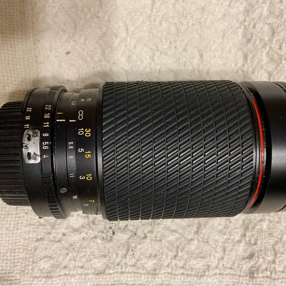 (2) Nikon F3 with Macro lens, light, zoom lens.